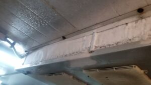 why is my walk-in cooler freezing up